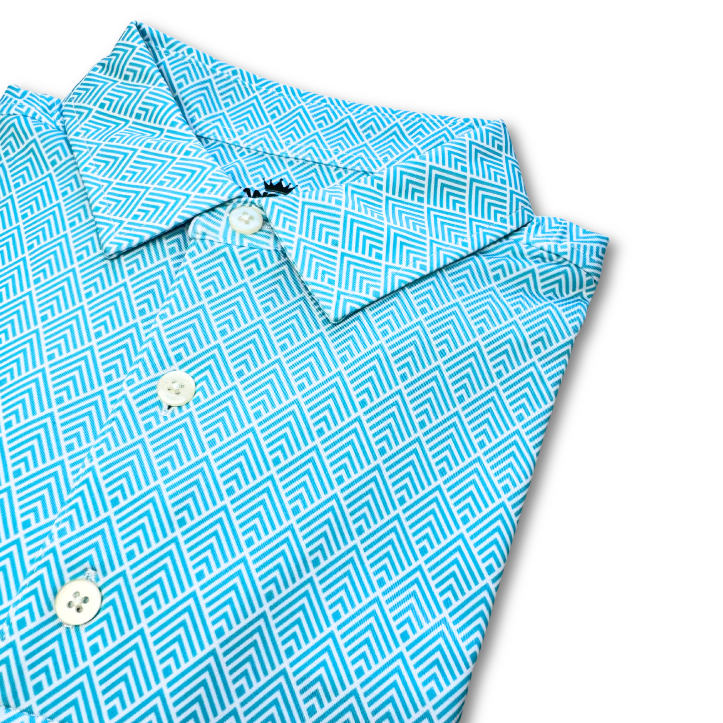 Folded blue geometric patterned shirt on a white background