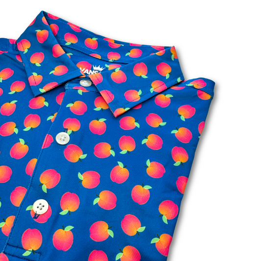 Blue polo shirt with peach pattern on a white background