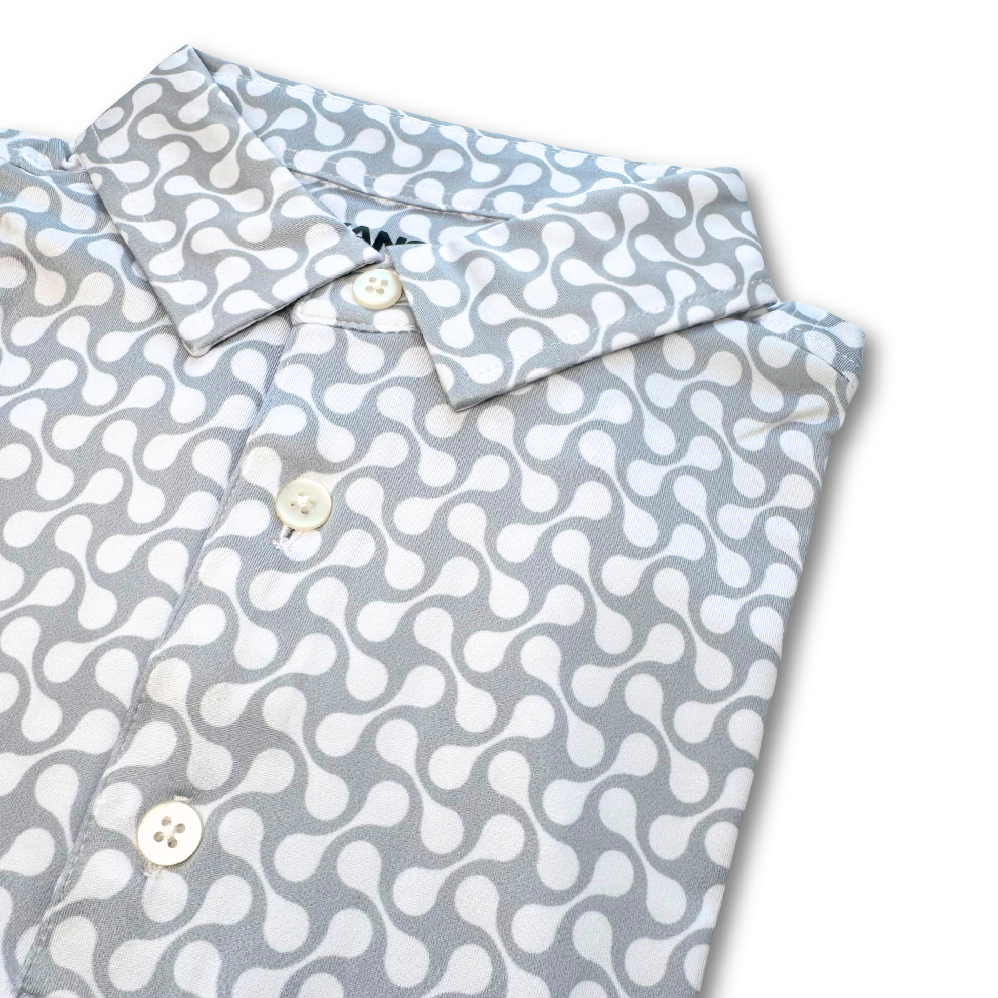 Folded shirt with a white pattern on a light gray background
