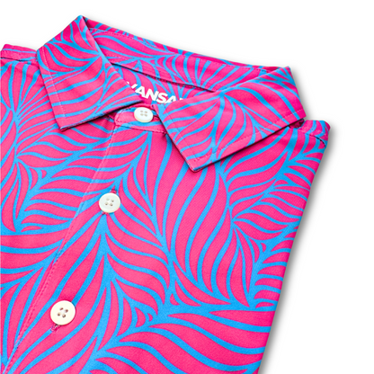 Pink and blue floral patterned shirt with  branding on a white background